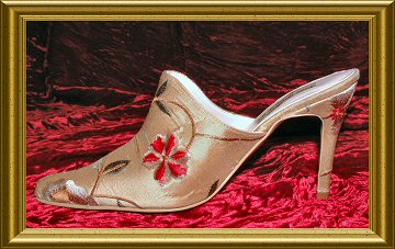 Eighteenth century, Marie Antoinette style mule.  Shown in an embroidered silk dupion.  Contact us to have many different styles of wedding shoes and boots covered in your own fabric.