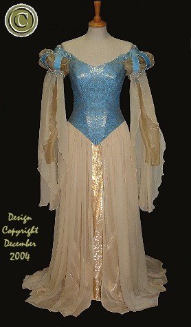Pre-raphaelite blue and gold brocade with chiffon skirts, pearl embellished wedding dress, full length view.
