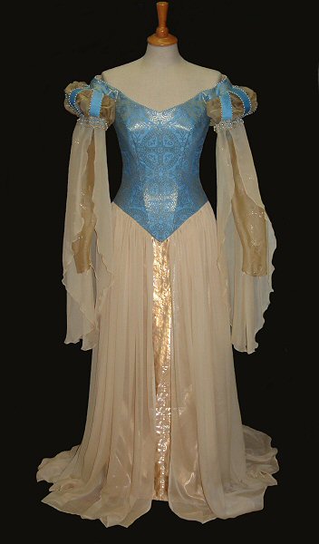 Pre-raphaelite blue and gold brocade with chiffon skirts, pearl embellished wedding dress, full length view.