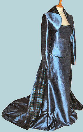 profile view pf the blue silk alternative wedding dress with bolero, corset and removeable train