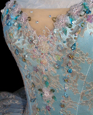 detail of crystal fountain fairy tutu in pale blue, lace and decorated with irridescent beads and stones 