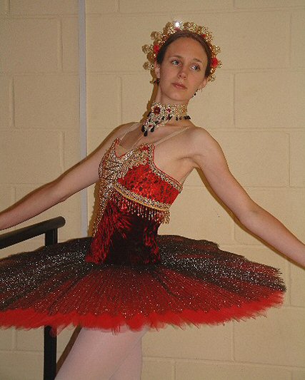 red, black and gold coloured tutu, embellished with gold