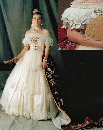This ivory lace and tulle gown was inspired by a painting of 
Elizabeth of Austria from a painting by Franz Russ, (c.1860).triple layered lace skirt over crinoline hoop. Velvet train with appliquéd detail. Intricately beaded boned bodice
over typical mid-nineteenth century corset. Complete reproduction costume including corset, crinoline, petticoats, bum-roll, beading. From £1200