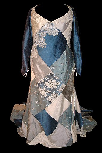 front view of the patchwork style dress in shades of blue, grey and ivory silk