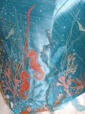 Detail of the applied seahorses in coral and red/gold silk.