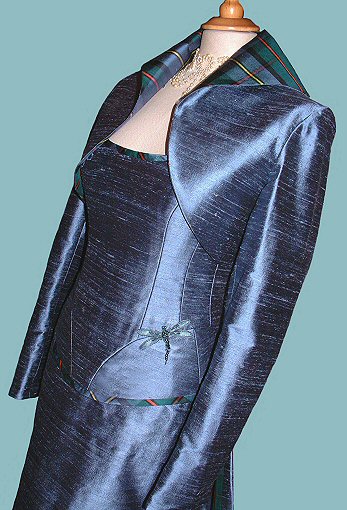 soft grey-blue silk corset and bolero jacket, with tartan trims and contrasting collar