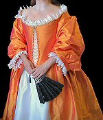 Restoration style gown in orange-pink silk.