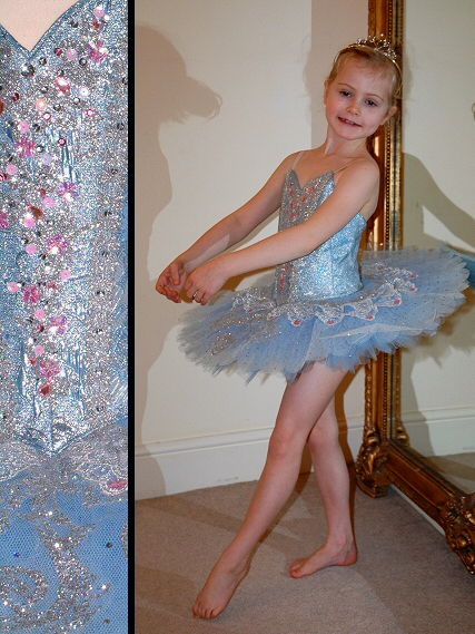 detail of silver decoration on pink classical tutu