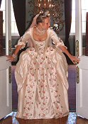 A stunning eighteenth century style wedding dress with pleated peplum on jacket, romantic embroidered cuffs with lace sleeve flounces.Shown in a pale pink embroidered regal dupion.  Also available in a buttermilk pale yellow, french grey/ blue, ivory and taupe/cream.  All with toning embroideries.