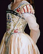 Elizabethan style gown with brocade bodice and silk skirts.