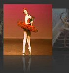 This dramatic 'Don Quixote'ballet tutu was commissioned by Cheshire Youth Ballet for a series of performances at the Lyceum Theatre, Crewe. The red silk bodice and matching net skirts were set off by the vibrantly contrasting black lace decoration. A matching headdress was constructed with a spanish comb effect
and red silk roses.